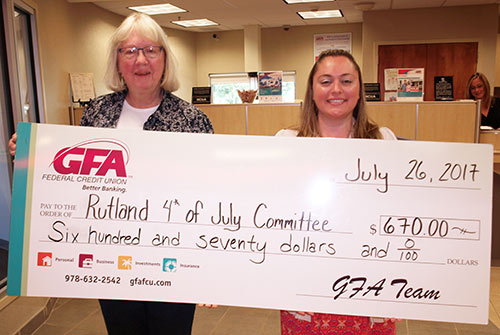 Heidi, GFA branch manager presents Karen Greenwood with a check for $670